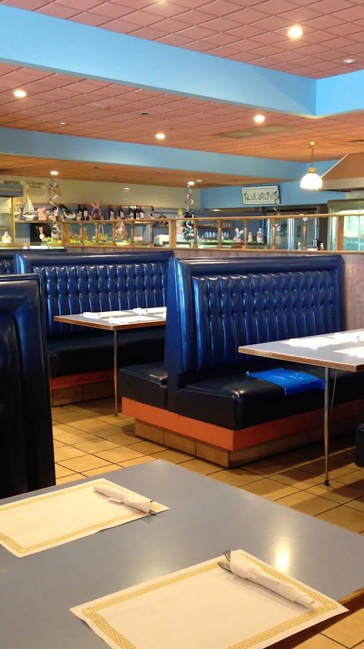 Diner booths and tables in a clean, casual dining room.